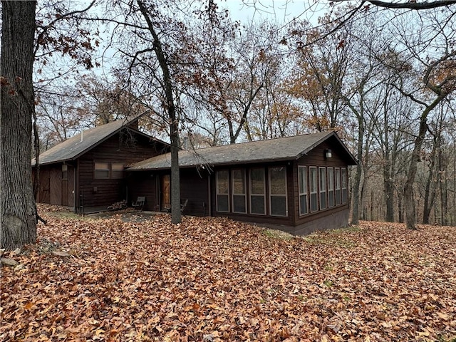 view of front of property featuring a sunroom