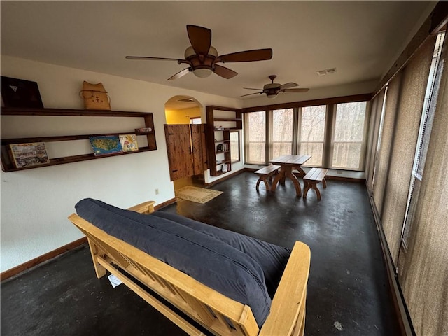 interior space featuring ceiling fan