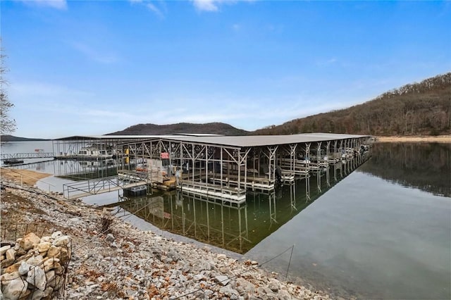 dock area featuring a water and mountain view