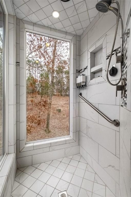 bathroom with a tile shower