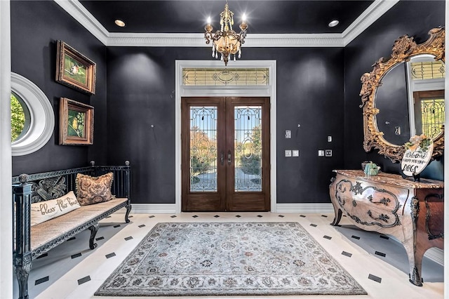 entryway with a chandelier, a healthy amount of sunlight, and french doors