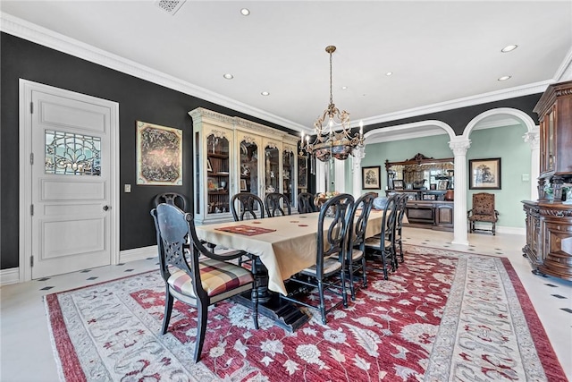 dining room with ornate columns and crown molding