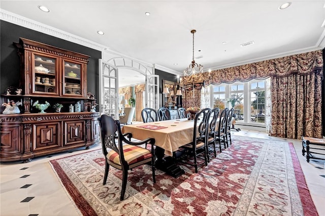 dining room with an inviting chandelier and crown molding