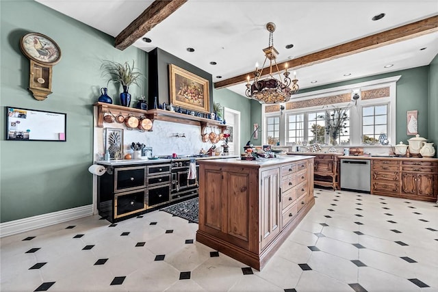 kitchen featuring an inviting chandelier, beamed ceiling, stainless steel dishwasher, pendant lighting, and a kitchen island