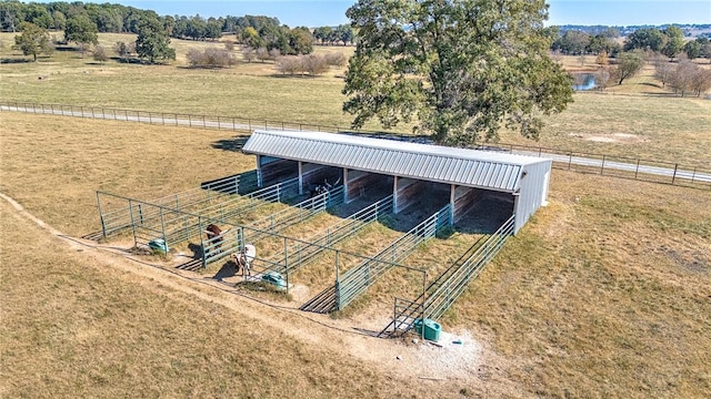 view of stable with a rural view