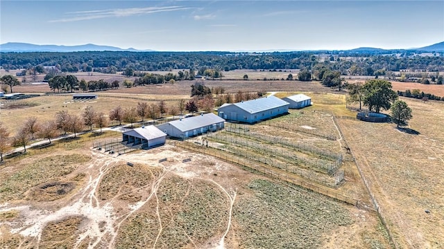 birds eye view of property featuring a mountain view and a rural view