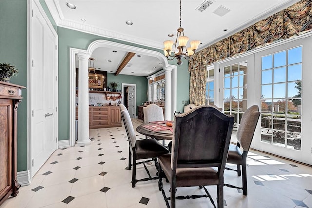 dining space featuring a chandelier, beam ceiling, crown molding, and decorative columns