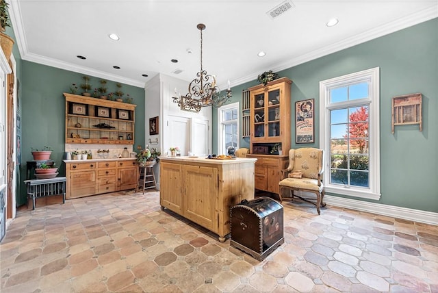 interior space featuring an inviting chandelier, hanging light fixtures, and ornamental molding