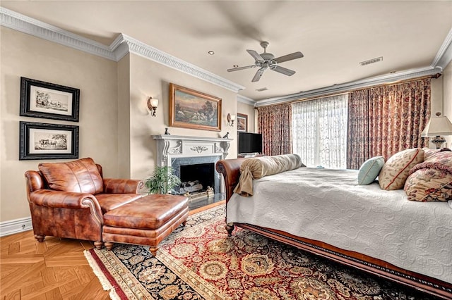 bedroom featuring crown molding, light parquet floors, and ceiling fan