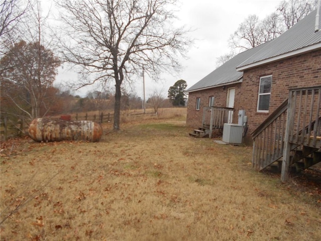 view of yard with central AC