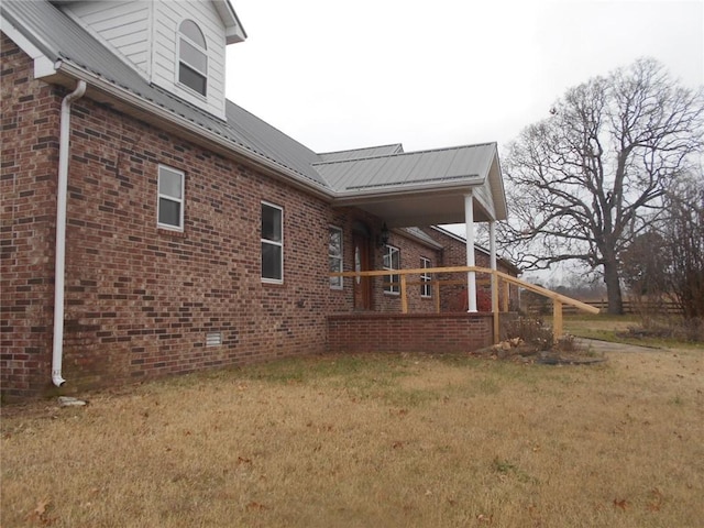 view of side of home featuring a lawn