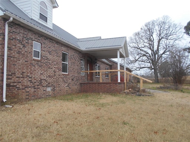 view of side of property with a yard