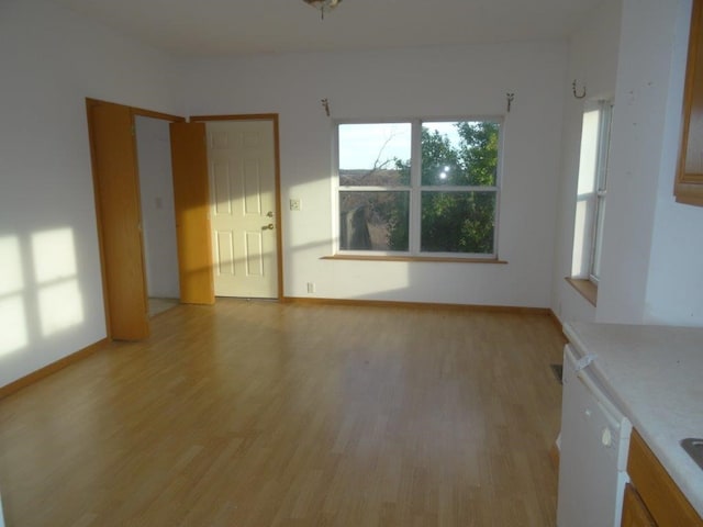 unfurnished living room with light wood-type flooring