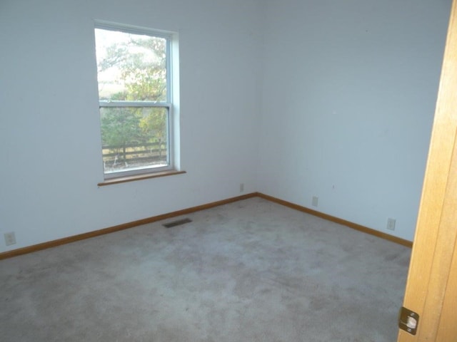 unfurnished room featuring carpet floors