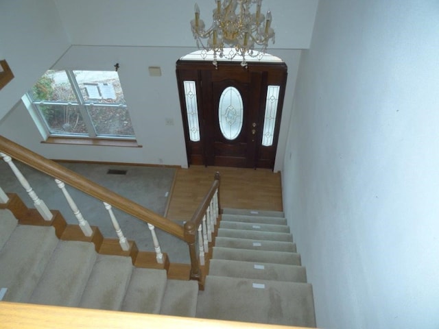 entrance foyer with a notable chandelier