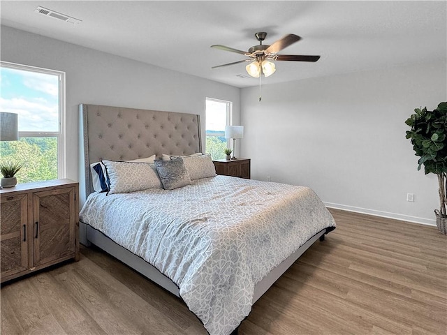 5341 Selah St, Springdale, AR 72764 - bedroom featuring wood finished floors and a ceiling fan