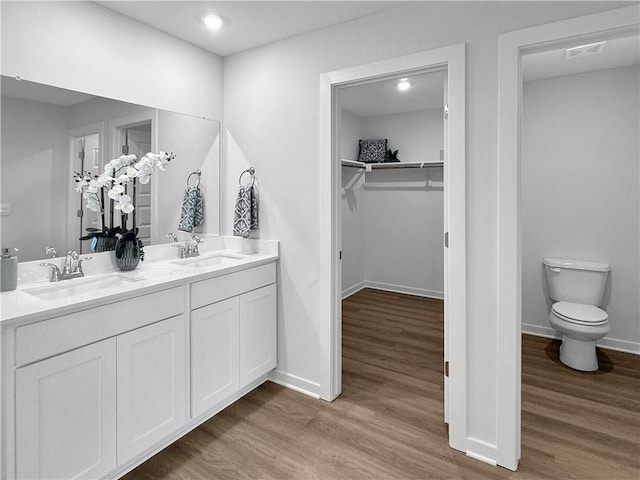 5341 Selah St, Springdale, AR 72764 - full bath featuring double vanity, wood finished floors, a spacious closet, and recessed lighting