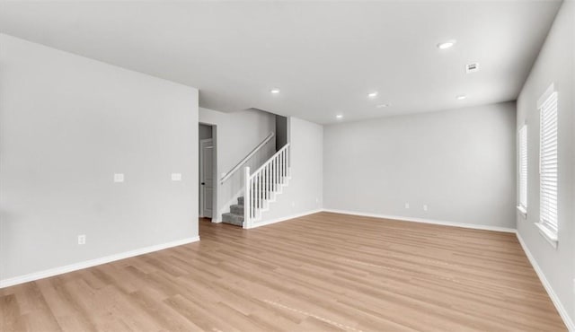 unfurnished room featuring light hardwood / wood-style floors