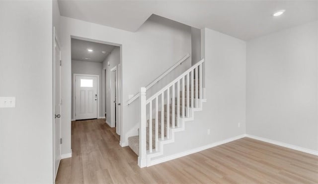 stairway featuring hardwood / wood-style floors