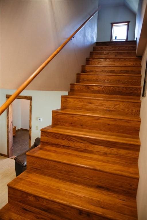 stairs featuring wood-type flooring