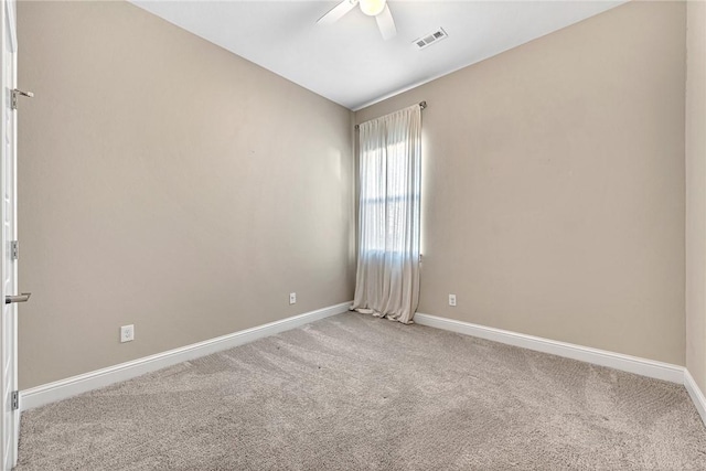 unfurnished room with ceiling fan and light colored carpet