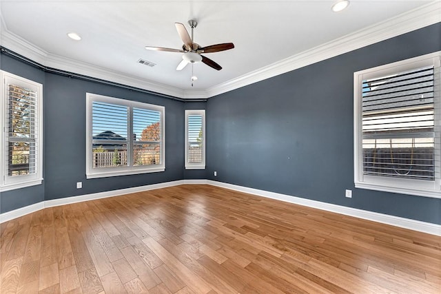 spare room featuring ceiling fan, wood-type flooring, and ornamental molding