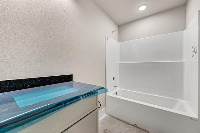 bathroom featuring shower / bath combination and vanity