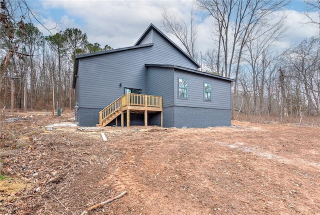 back of property featuring a deck