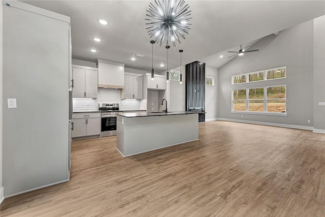 117 Kinross Dr, Bella Vista, AR 72715 - kitchen featuring stainless steel electric range oven, open floor plan, dark countertops, recessed lighting, and a chandelier