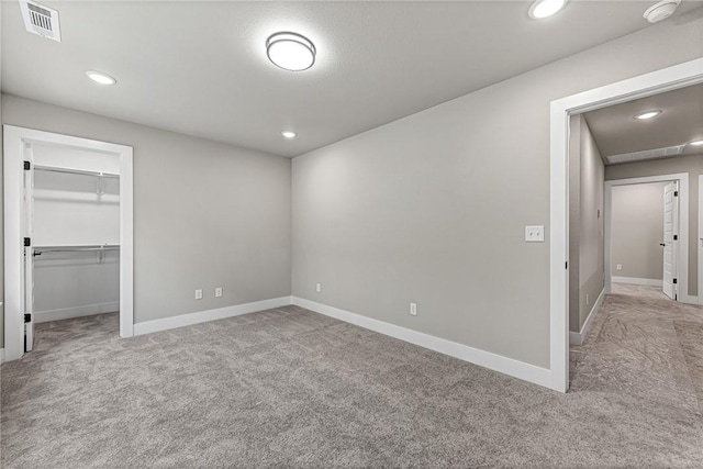 117 Kinross Dr, Bella Vista, AR 72715 - unfurnished bedroom with carpet floors, recessed lighting, a spacious closet, and a closet