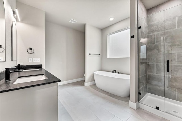 117 Kinross Dr, Bella Vista, AR 72715 - full bathroom featuring double vanity, a stall shower, a soaking tub, and tile patterned floors