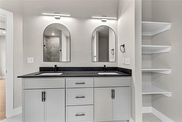 117 Kinross Dr, Bella Vista, AR 72715 - bathroom with double vanity and baseboards
