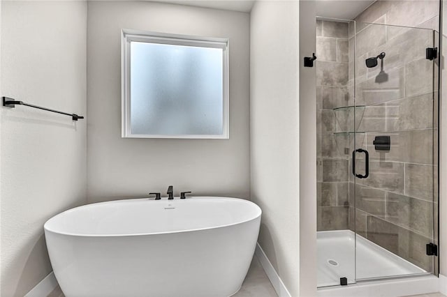 117 Kinross Dr, Bella Vista, AR 72715 - bathroom featuring a shower stall and a freestanding bath