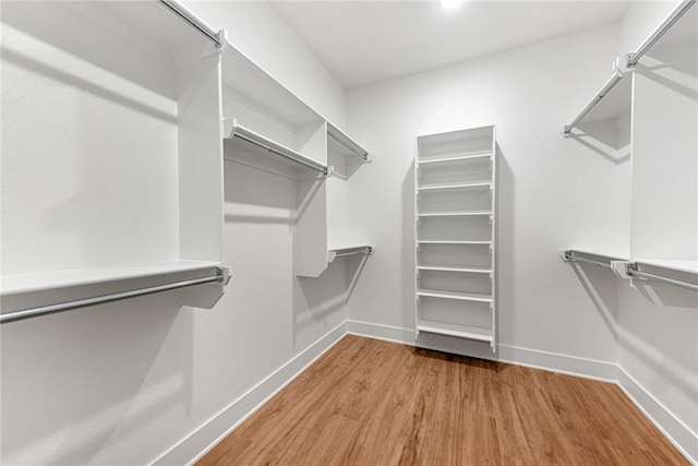 117 Kinross Dr, Bella Vista, AR 72715 - walk in closet featuring wood finished floors