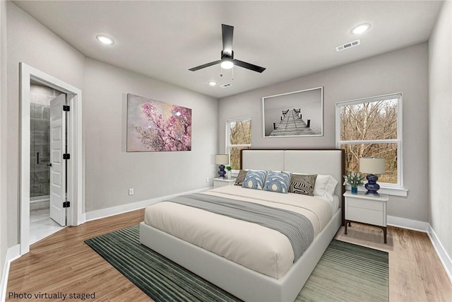 117 Kinross Dr, Bella Vista, AR 72715 - bedroom with wood finished floors, recessed lighting, a ceiling fan, and ensuite bathroom