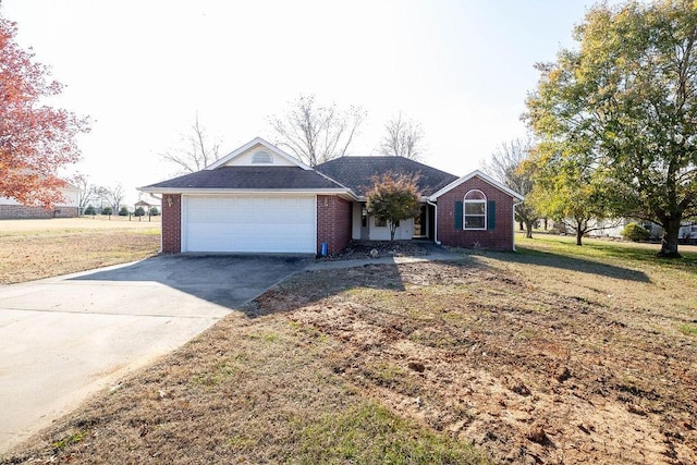 single story home with a garage and a front lawn