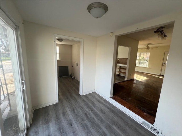 interior space featuring dark hardwood / wood-style flooring and ceiling fan