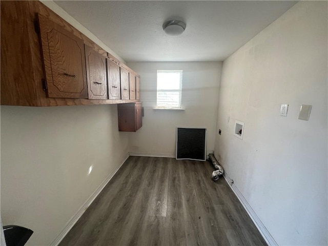 clothes washing area with electric dryer hookup, hookup for a washing machine, hardwood / wood-style floors, and cabinets