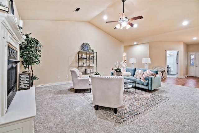 carpeted living room with recessed lighting, visible vents, a ceiling fan, vaulted ceiling, and baseboards