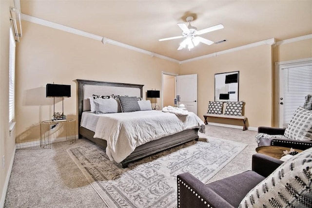 bedroom with ceiling fan, light carpet, visible vents, baseboards, and ornamental molding