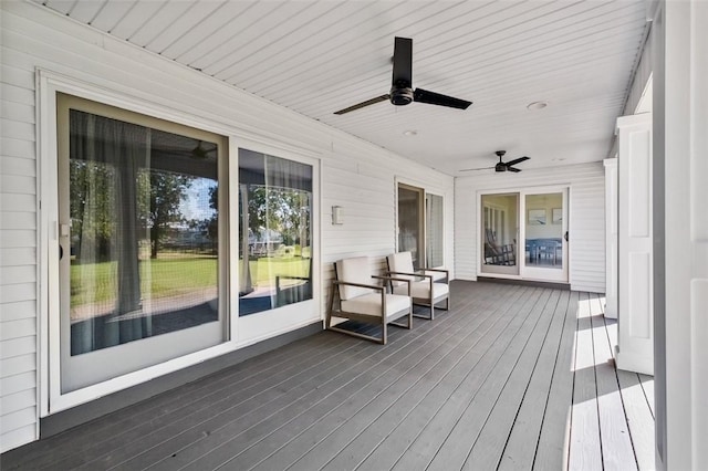 wooden terrace with ceiling fan