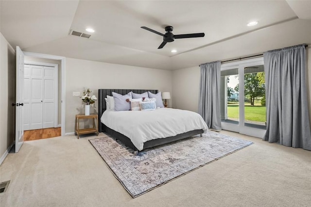 bedroom featuring light carpet, access to outside, and ceiling fan