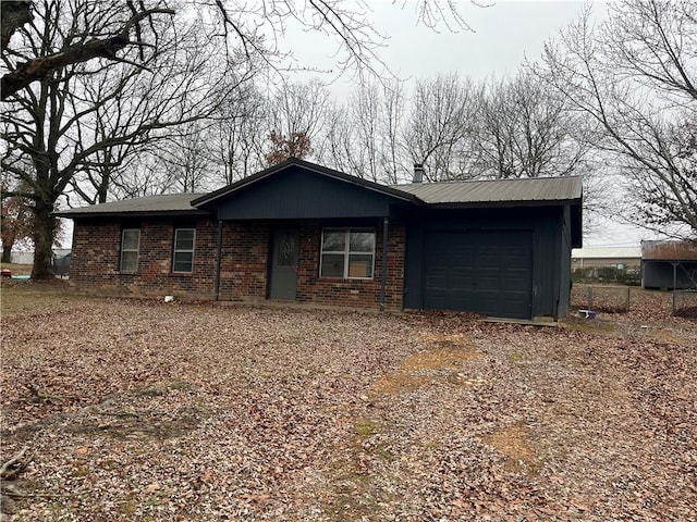 ranch-style home featuring driveway, brick siding, and an attached garage