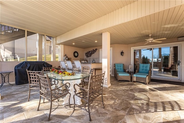 view of patio with ceiling fan and a grill