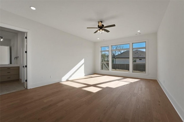 4201 88th St, Bentonville, AR 72718 - unfurnished bedroom featuring recessed lighting, wood finished floors, ensuite bath, and baseboards