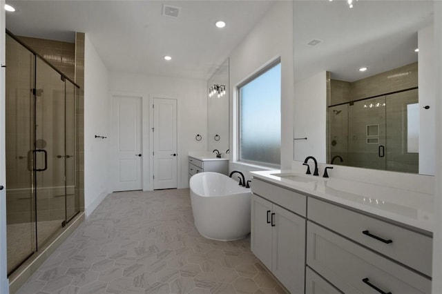 4201 88th St, Bentonville, AR 72718 - bathroom featuring a freestanding tub, vanity, a stall shower, and visible vents