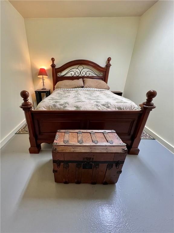 bedroom with concrete floors