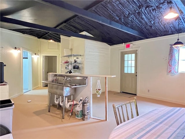 kitchen featuring a kitchen breakfast bar, lofted ceiling, and decorative light fixtures