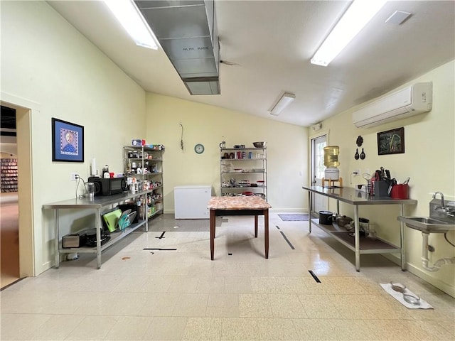 interior space featuring vaulted ceiling and a wall mounted AC