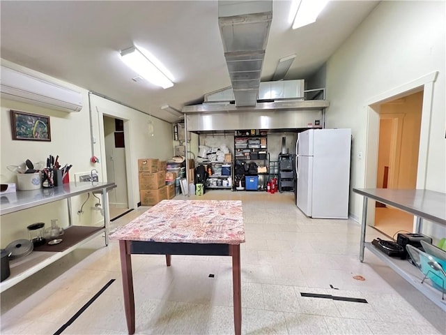 basement featuring a wall mounted air conditioner and white fridge